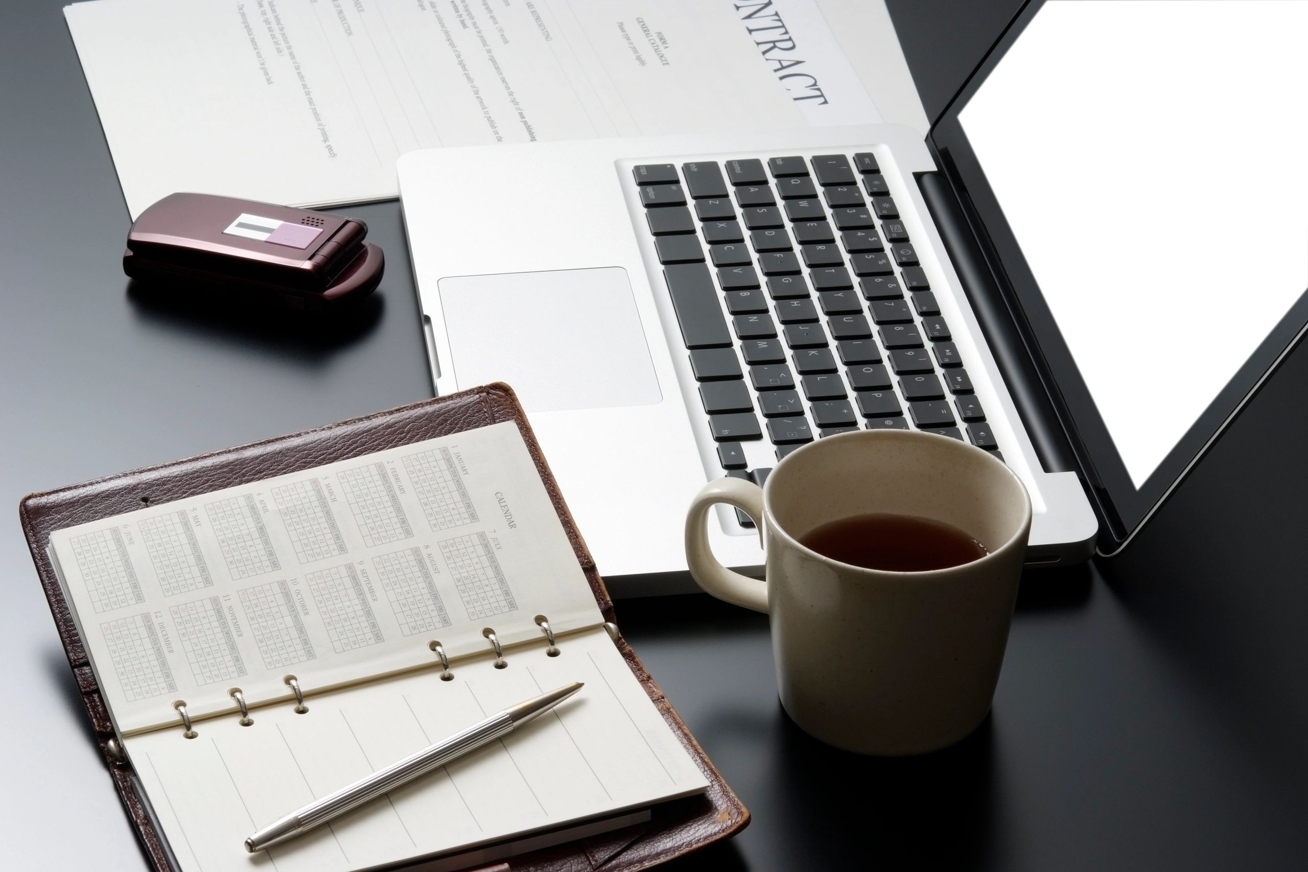 Business planning tools on a dark desk